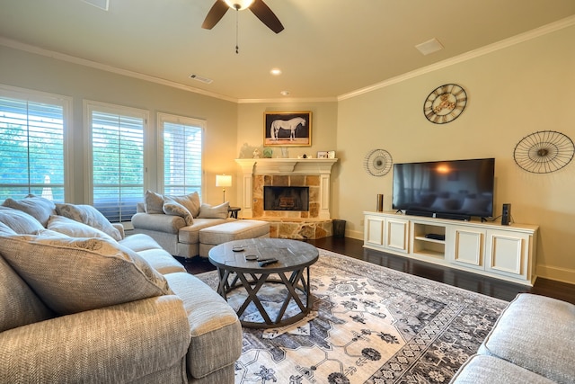 103 Fireside Ct, Mclendon Chisholm, TX 75032 - living room featuring a ceiling fan, dark wood-style flooring, crown molding, and a tiled fireplace