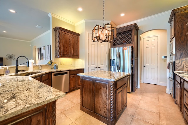 103 Fireside Ct, Mclendon Chisholm, TX 75032 - kitchen with stainless steel appliances, decorative light fixtures, a chandelier, light stone counters, and decorative backsplash