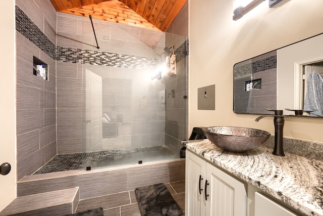 103 Fireside Ct, Mclendon Chisholm, TX 75032 - full bathroom featuring lofted ceiling, vanity, tiled shower, and wood ceiling