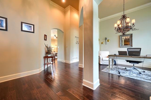 103 Fireside Ct, Mclendon Chisholm, TX 75032 - entryway featuring ornamental molding, dark wood-type flooring, a towering ceiling, arched walkways, and a chandelier
