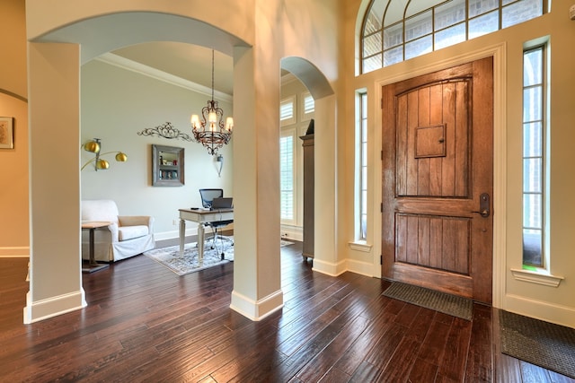 103 Fireside Ct, Mclendon Chisholm, TX 75032 - entrance foyer featuring healthy amount of natural light, arched walkways, ornamental molding, and dark wood-type flooring
