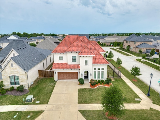 view of front of property with a residential view, driveway, a tiled roof, and stucco siding