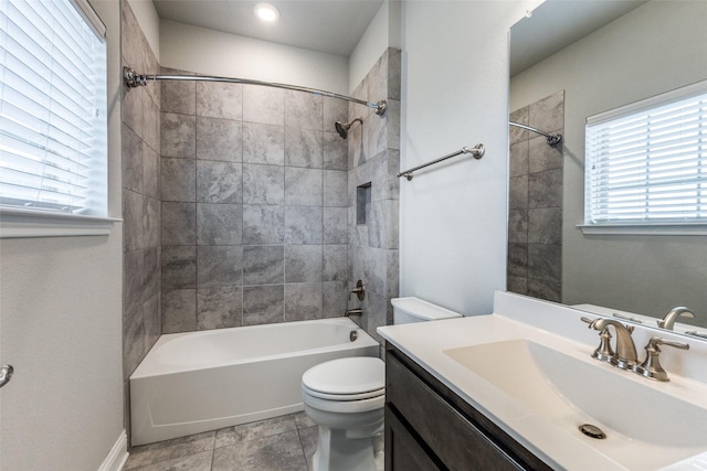 bathroom featuring toilet, shower / bathtub combination, and vanity