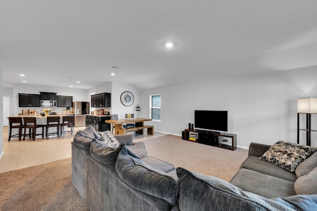 living room featuring light colored carpet, recessed lighting, baseboards, and light tile patterned flooring