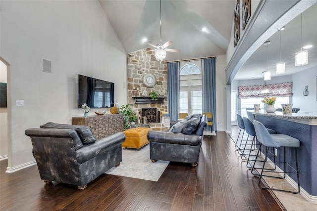 1332 Needle Cactus Dr, Fort Worth, TX 76177 - living room featuring arched walkways, a high ceiling, a ceiling fan, dark wood finished floors, and baseboards