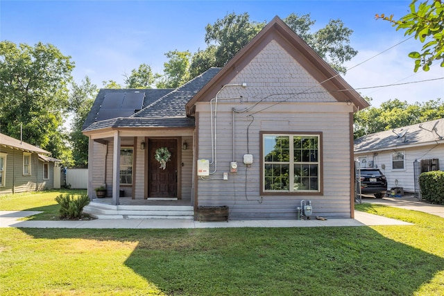 741 N Robinson St, Cleburne, TX 76031 - view of front of home featuring a front lawn, a porch, and a shingled roof