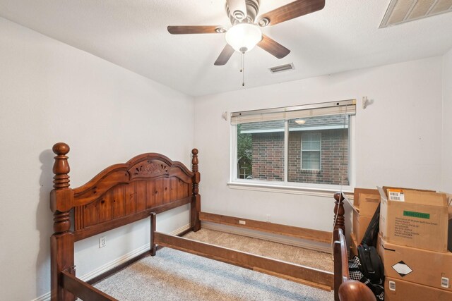 bedroom with carpet, baseboards, and a ceiling fan