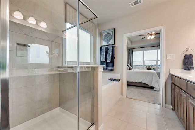 126 Range Ln, Decatur, TX 76234 - ensuite bathroom with a stall shower, tile patterned flooring, vanity, and a ceiling fan