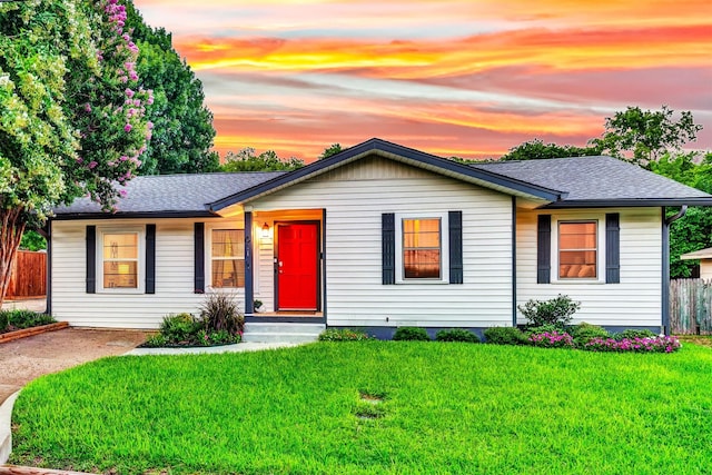 ranch-style house with a shingled roof