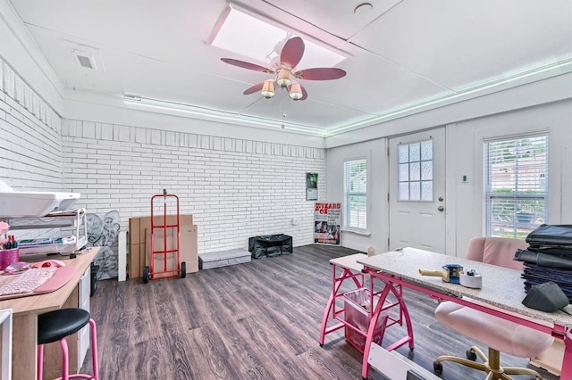 112 S Wood Ave, Denison, TX 75020 - home office featuring plenty of natural light, dark wood-type flooring, brick wall, and ceiling fan