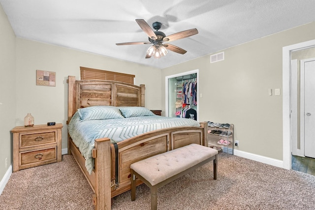 112 S Wood Ave, Denison, TX 75020 - carpeted bedroom with baseboards, a closet, and a ceiling fan