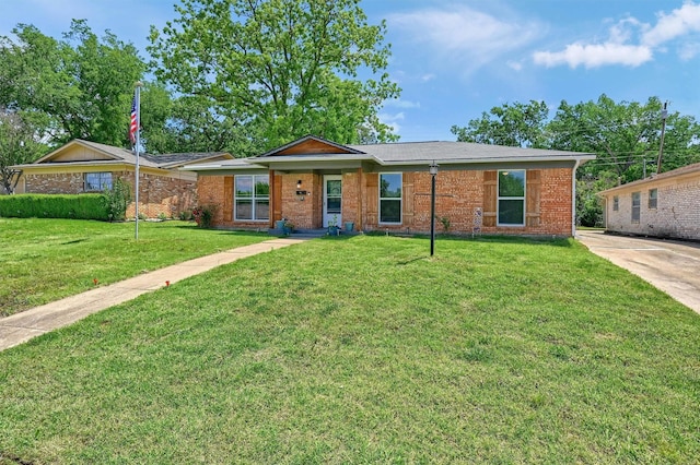 112 S Wood Ave, Denison, TX 75020 - single story home with a front yard and brick siding