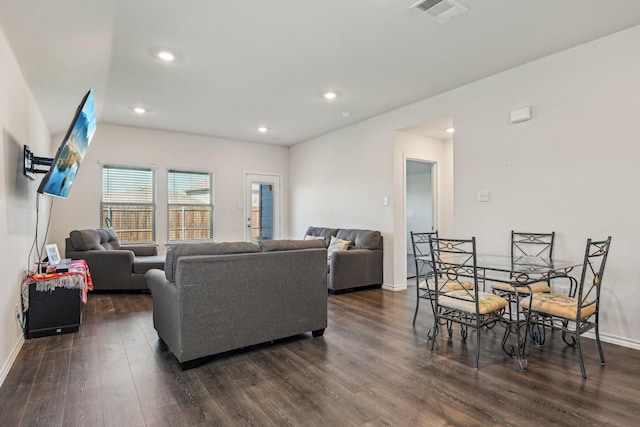 living room with dark wood finished floors, recessed lighting, and baseboards