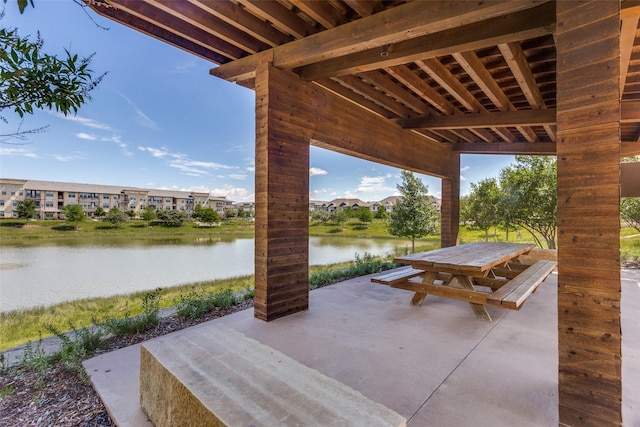 7412 Foxgrass Pl, Fort Worth, TX 76123 - view of patio / terrace featuring outdoor dining area and a water view