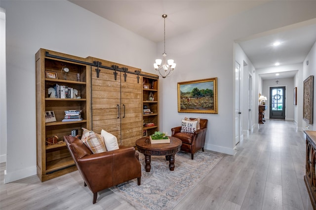 7412 Foxgrass Pl, Fort Worth, TX 76123 - sitting room with a barn door, light wood-style floors, baseboards, a chandelier, and recessed lighting