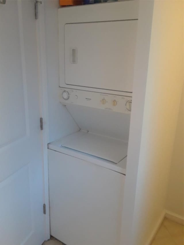 3817 Gilbert Ave Unit 108, Dallas, TX 75219 - washroom featuring stacked washer / drying machine
