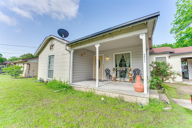 2957 Darby Dr, Dallas, TX 75227 - rear view of property featuring a porch