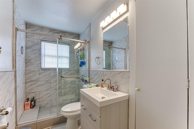2957 Darby Dr, Dallas, TX 75227 - bathroom featuring tile walls, a stall shower, vanity, and toilet