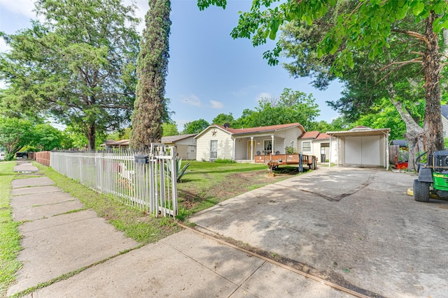 2957 Darby Dr, Dallas, TX 75227 - ranch-style home featuring driveway, a detached carport, and covered porch