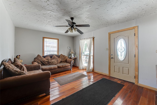 2957 Darby Dr, Dallas, TX 75227 - foyer featuring plenty of natural light, ceiling fan, hardwood / wood-style flooring, and baseboards