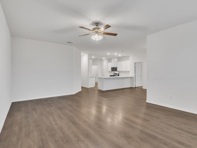 1116 Cobalt Dr, Celina, TX 75009 - unfurnished living room featuring ceiling fan, baseboards, dark wood-style floors, and recessed lighting