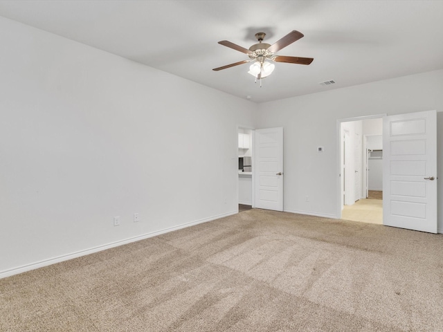 1116 Cobalt Dr, Celina, TX 75009 - unfurnished bedroom featuring light colored carpet, a walk in closet, baseboards, and a ceiling fan