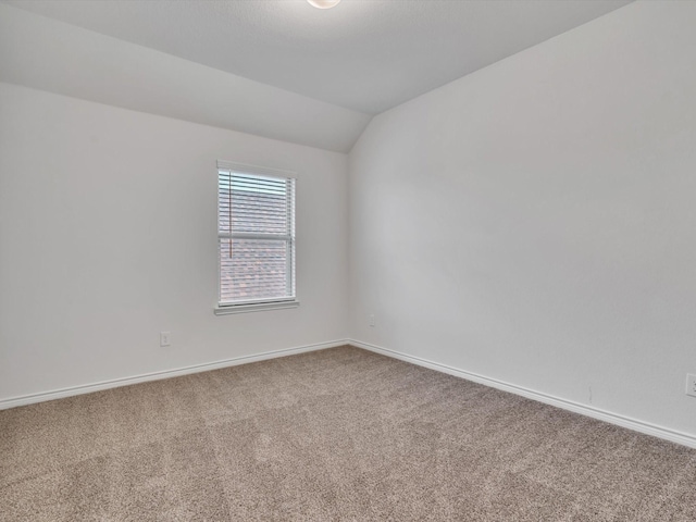 1116 Cobalt Dr, Celina, TX 75009 - carpeted empty room featuring vaulted ceiling and baseboards