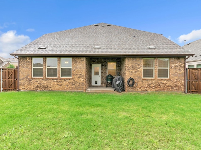 1116 Cobalt Dr, Celina, TX 75009 - back of property with a gate, a shingled roof, brick siding, and a patio area