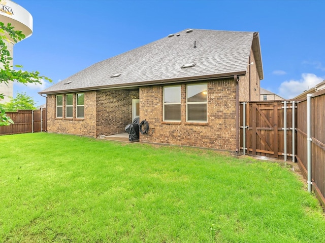 1116 Cobalt Dr, Celina, TX 75009 - back of property with a gate, roof with shingles, and brick siding