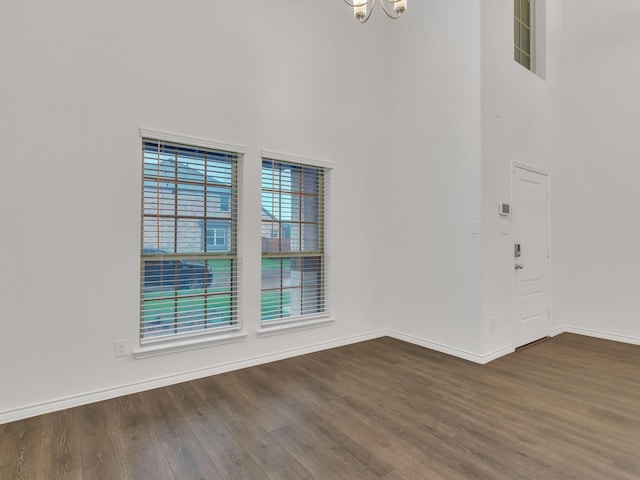 1116 Cobalt Dr, Celina, TX 75009 - entryway featuring dark wood finished floors, a chandelier, baseboards, and a towering ceiling