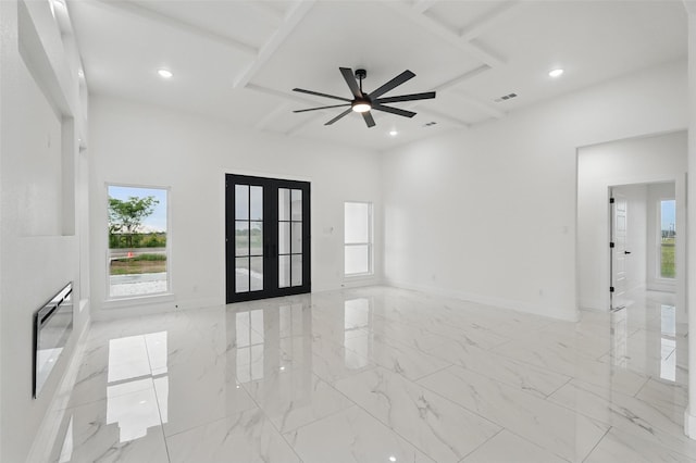 empty room featuring french doors, a ceiling fan, recessed lighting, baseboards, and light marble finish flooring