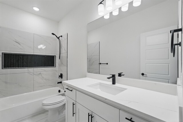 full bath with marble finish flooring, bathtub / shower combination, toilet, vanity, and recessed lighting