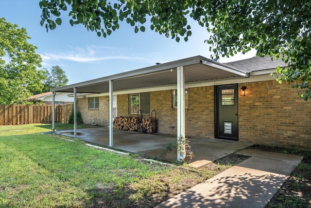 407 Sunset St, Malakoff, TX 75148 - back of house featuring brick siding and a patio