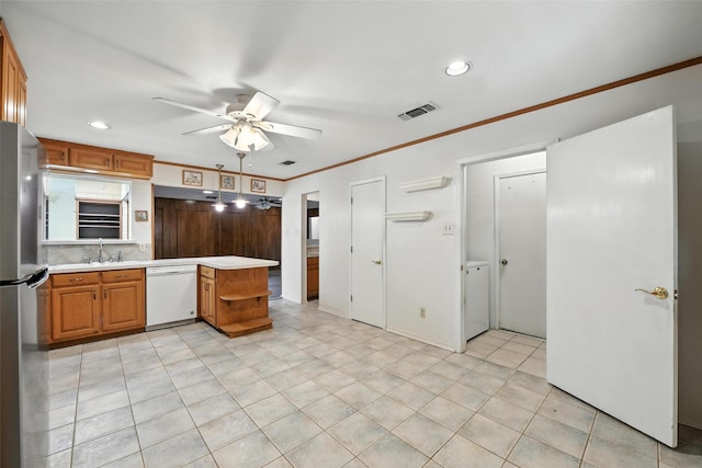 3908 Windhaven Rd, Fort Worth, TX 76133 - kitchen with white dishwasher, freestanding refrigerator, light countertops, a peninsula, and a ceiling fan