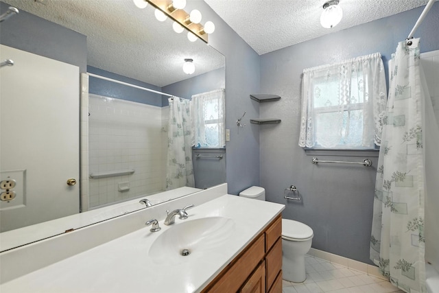 3908 Windhaven Rd, Fort Worth, TX 76133 - bathroom with vanity, a textured ceiling, curtained shower, and tile patterned flooring