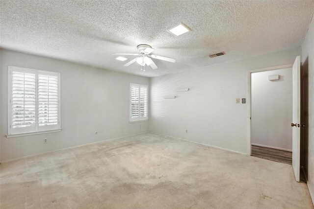 3908 Windhaven Rd, Fort Worth, TX 76133 - empty room featuring ceiling fan, a textured ceiling, and carpet flooring