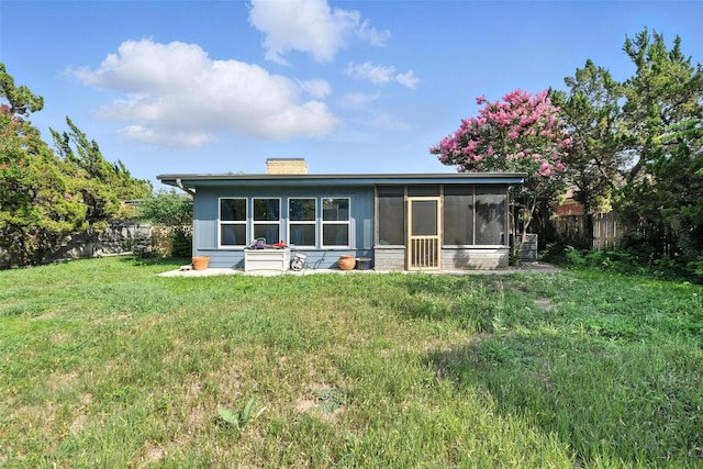 3908 Windhaven Rd, Fort Worth, TX 76133 - rear view of house with a chimney and a sunroom