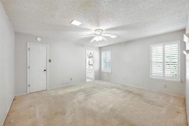 3908 Windhaven Rd, Fort Worth, TX 76133 - empty room with a ceiling fan, carpet flooring, a textured ceiling, and a smoke detector