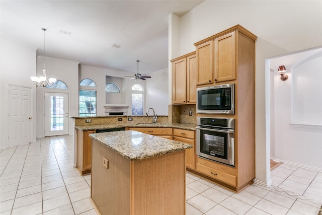 212 Longview Ct, Keller, TX 76248 - kitchen featuring stainless steel appliances, a peninsula, a center island, and light tile patterned floors
