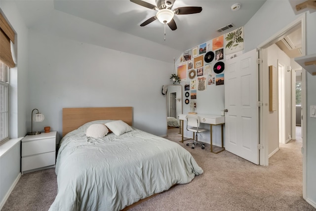 carpeted bedroom with lofted ceiling, ceiling fan, and baseboards