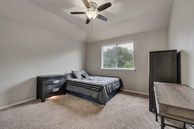 carpeted bedroom with baseboards and a ceiling fan