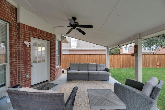 view of patio with outdoor lounge area and ceiling fan