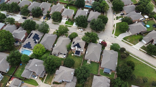 aerial view of property and surrounding area featuring nearby suburban area, property boundaries highlighted, and a pool