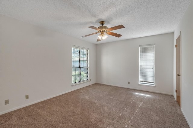619 Wellington, Tyler, TX 75703 - carpeted spare room with ceiling fan, a textured ceiling, and baseboards