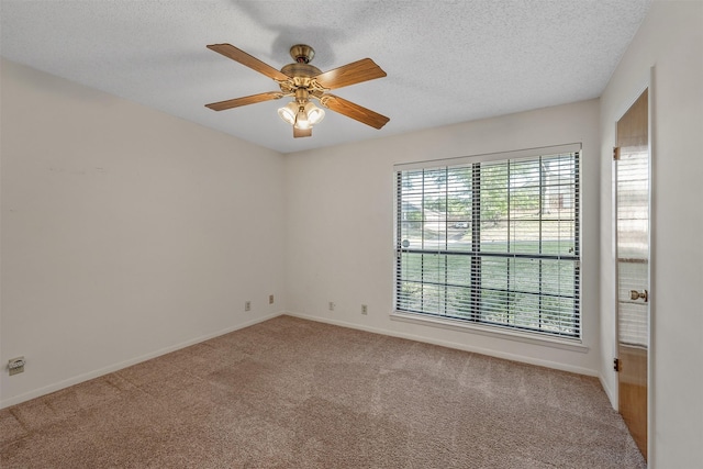 619 Wellington, Tyler, TX 75703 - empty room featuring carpet, baseboards, a textured ceiling, and ceiling fan