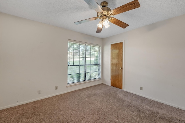 619 Wellington, Tyler, TX 75703 - empty room featuring carpet, baseboards, a textured ceiling, and a ceiling fan