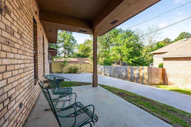 619 Wellington, Tyler, TX 75703 - view of patio with a fenced backyard