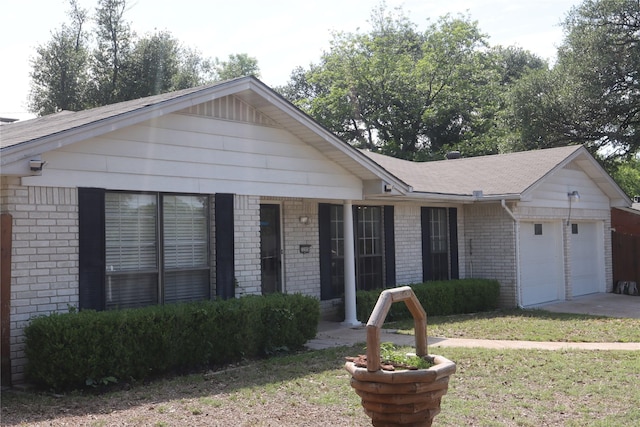 3205 Pin Oak Dr, Temple, TX 76502 - ranch-style home featuring an attached garage, brick siding, driveway, and a front yard