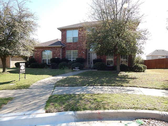 traditional-style home featuring brick siding