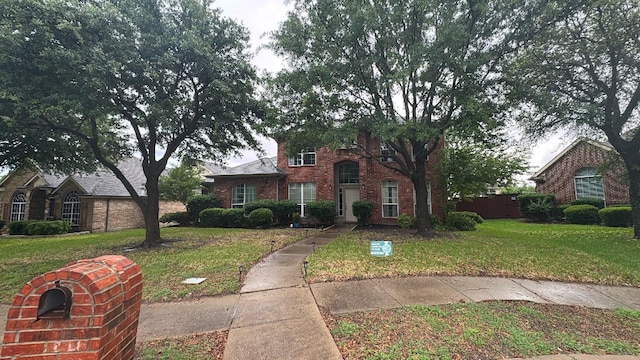 1423 Red Wolf Dr, Rockwall, TX 75087 - view of front of property with a front lawn and brick siding